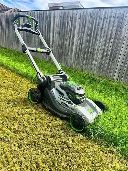 AOK Mowing battery push mower cutting a residential lawn in Ipswich