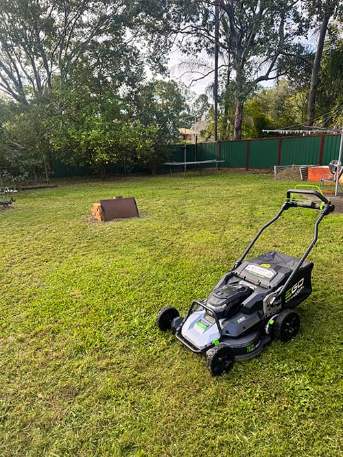 commercial battery lawn mowing job in Flinders View mowing residential house