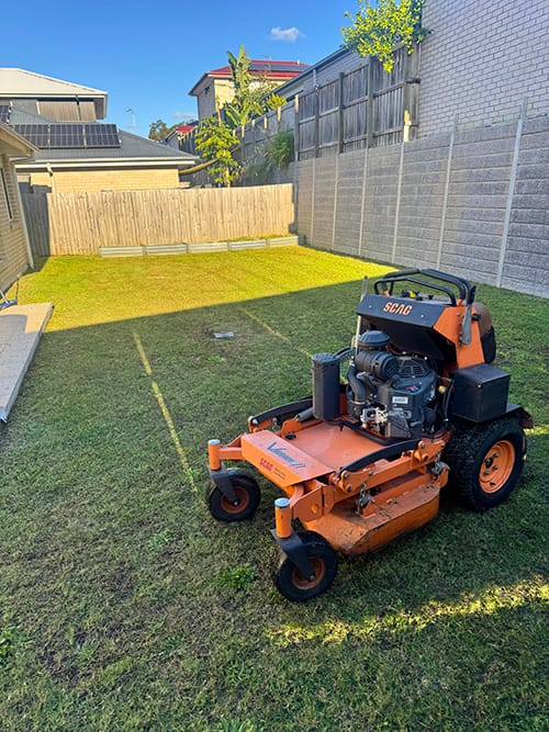 commercial ride on lawn mowing job in South Ripley mowing residential backyard