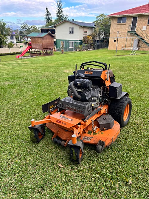 ride on lawn mowing job in Booval mowing large backyard