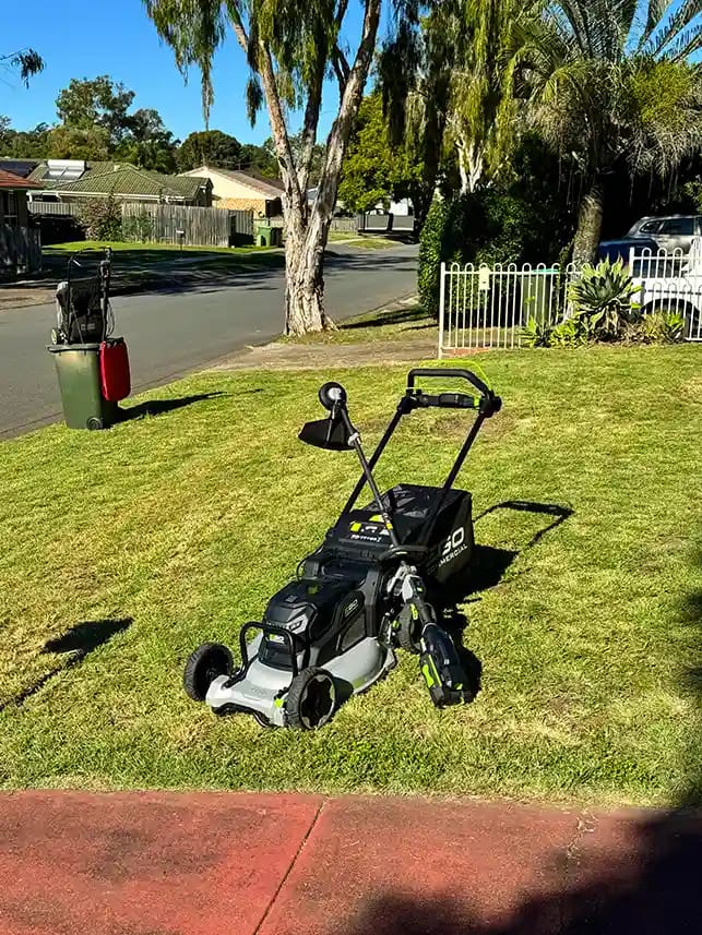 AOK Mowing commercial battery push mower and line trimmer after photo of lawn mowing in ipswich
